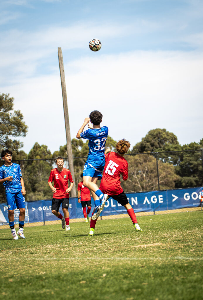 Members of Box Hill United Football Club playing soccer